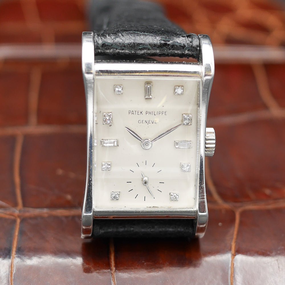 Patek Philippe Hour Glass Ref. 2456, platinum case, 29x22mm, circa 1945, rare vintage watch with diamond minute dots.