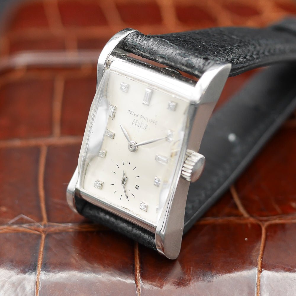 Patek Philippe Hour Glass Ref. 2456, platinum case, 29x22mm, circa 1945, rare vintage watch with diamond minute dots.