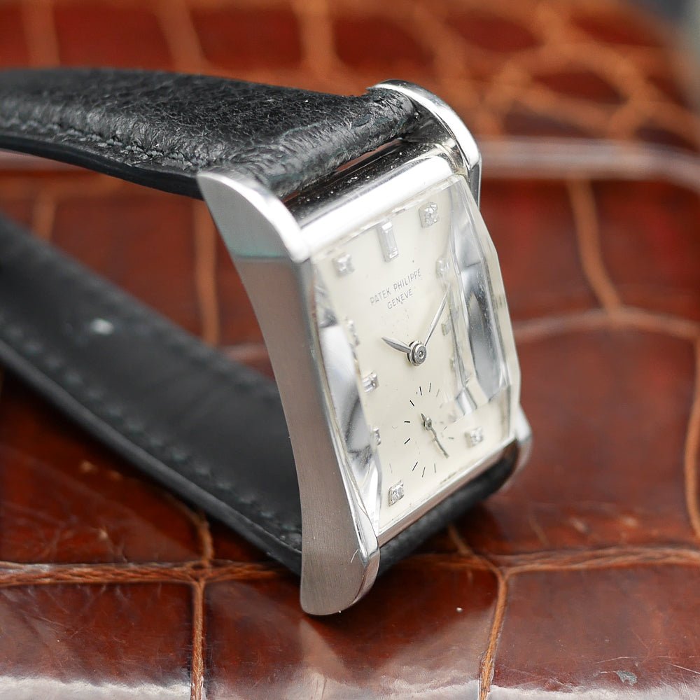 Patek Philippe Hour Glass Ref. 2456, platinum case, 29x22mm, circa 1945, rare vintage watch with diamond minute dots.