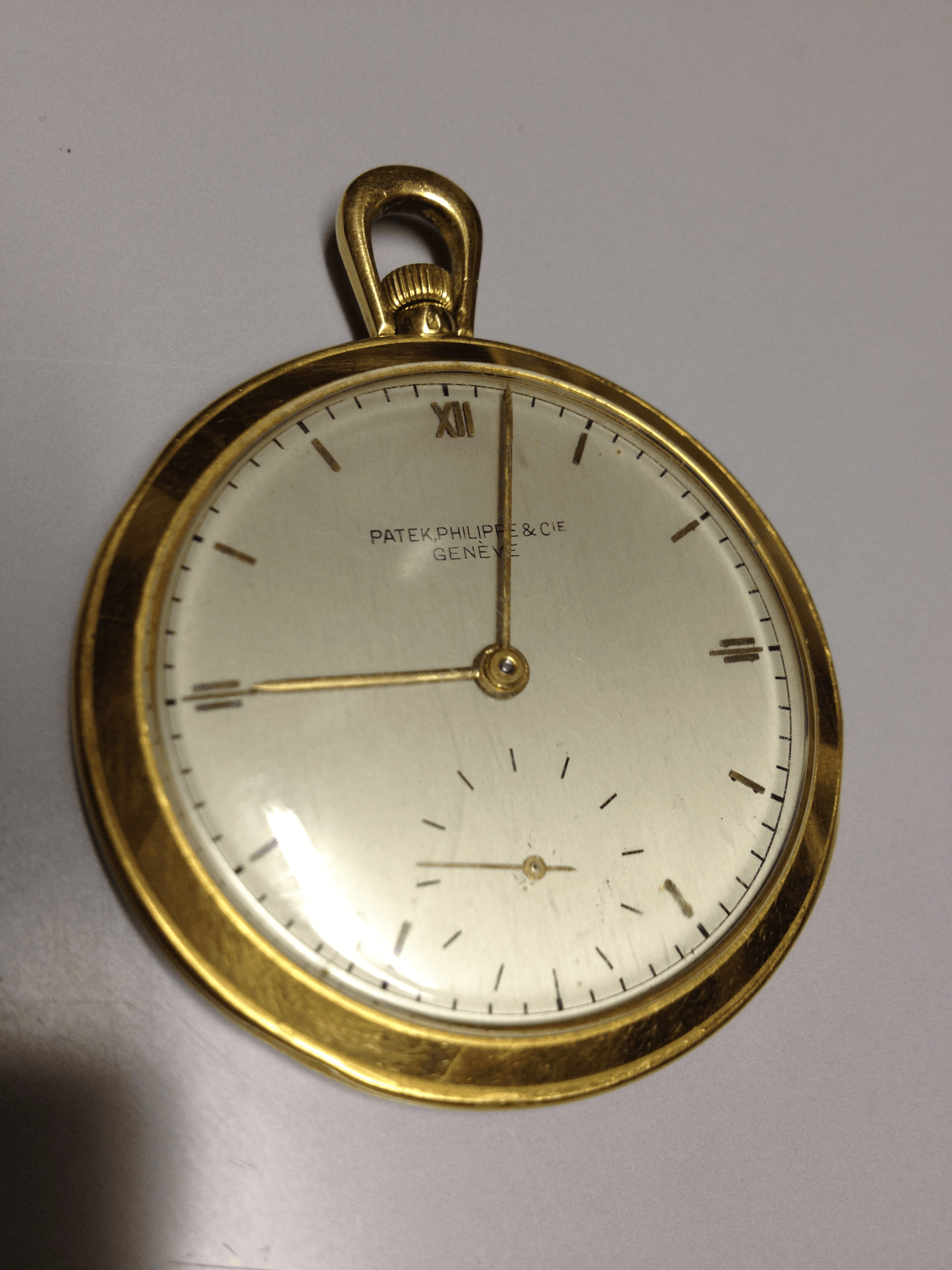Vintage Patek Philippe pocket watch in yellow gold, circa 1940, featuring a small seconds subdial at 6 o’clock.