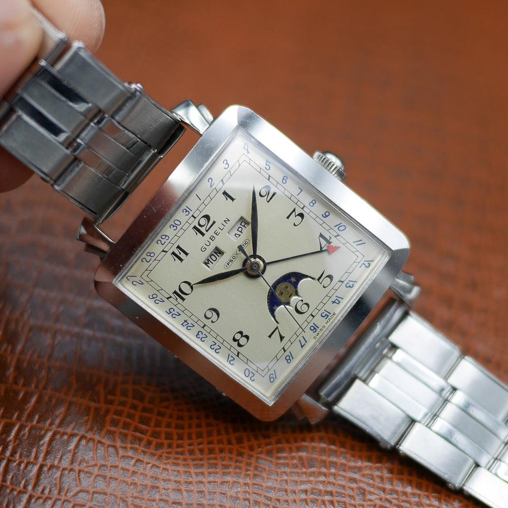 Gubelin stainless steel watch, vintage 1950, classic design, Swiss craftsmanship, timeless elegance.