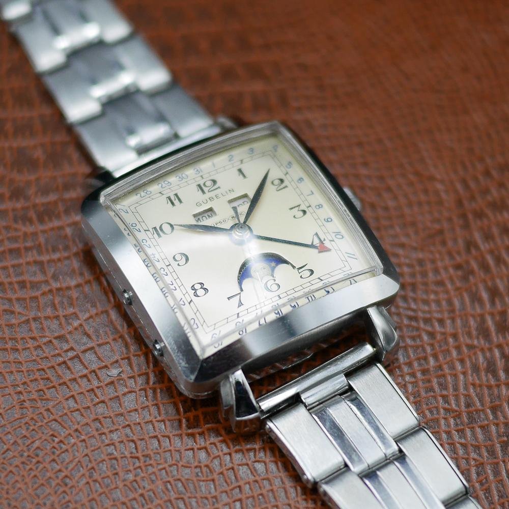 Gubelin stainless steel watch, vintage 1950, classic design, Swiss craftsmanship, timeless elegance.