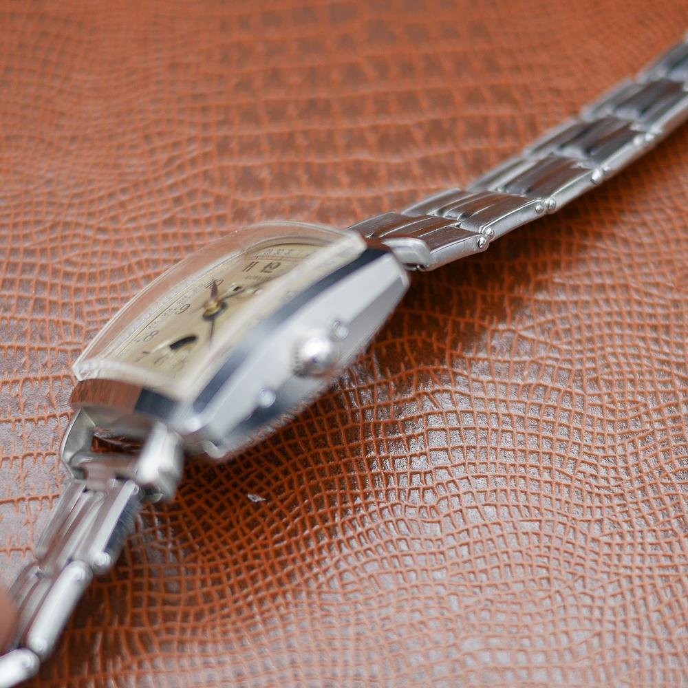 Gubelin stainless steel watch, vintage 1950, classic design, Swiss craftsmanship, timeless elegance.