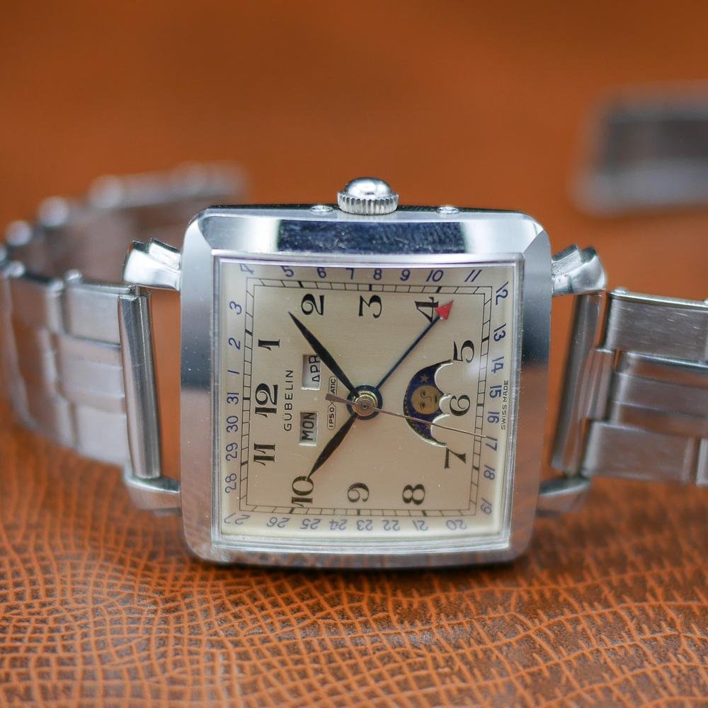 Gubelin stainless steel watch, vintage 1950, classic design, Swiss craftsmanship, timeless elegance.
