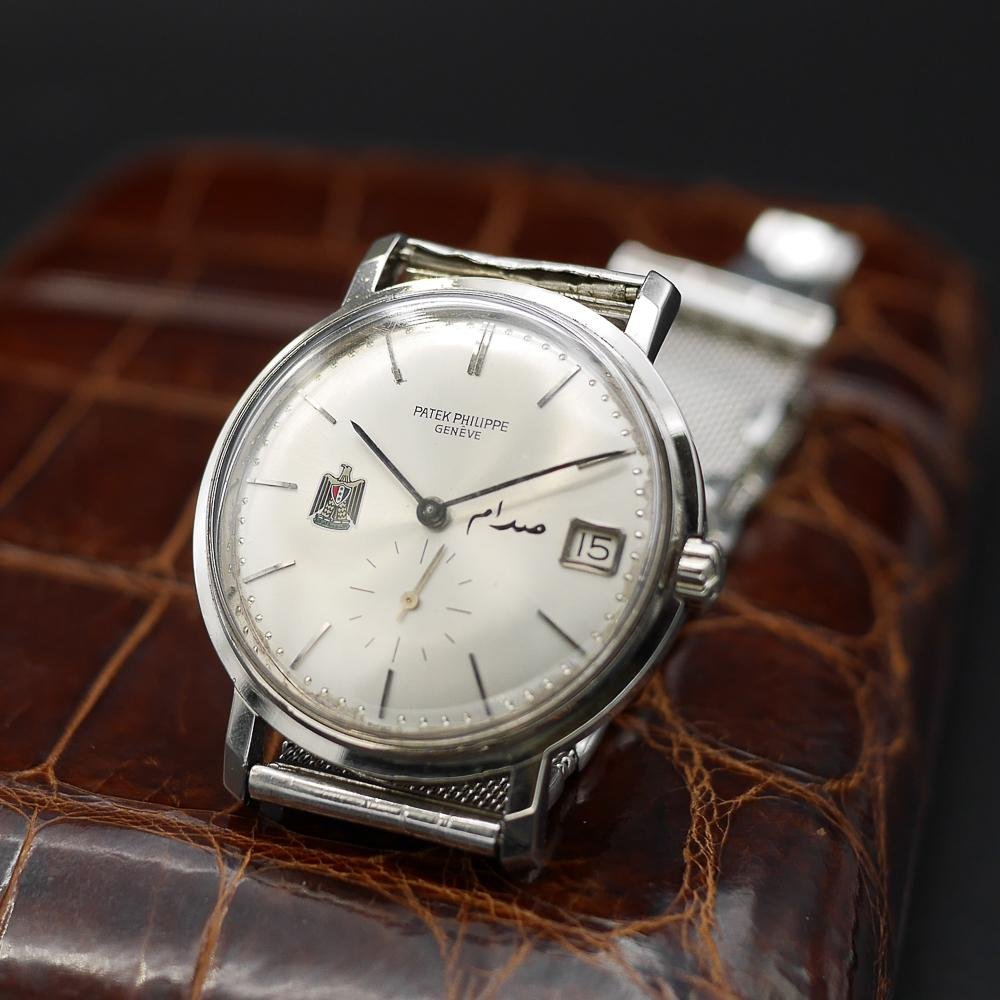 Patek Philippe Calatrava Ref 3445, white gold, circa 1960. Featuring Egypt’s coat of arms, silver dial, and the first automatic date movement.