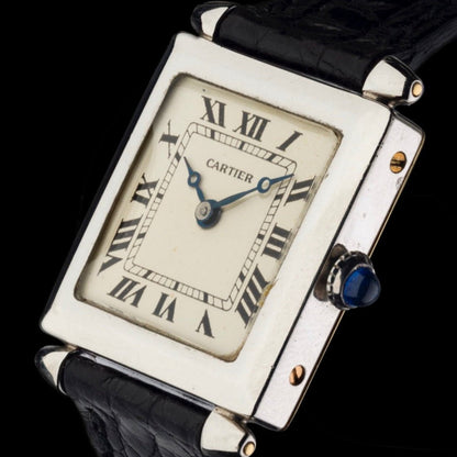 Cartier Tank Obus 1926 in platinum, featuring a rare square case and Art Deco-inspired design. A highly collectible vintage Cartier masterpiece.