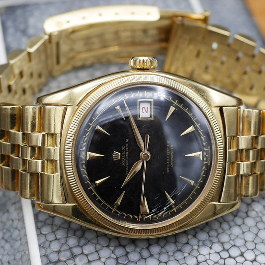 Rolex Oyster Perpetual Date Ref: 6075 in Yellow gold. Circa: 1950.