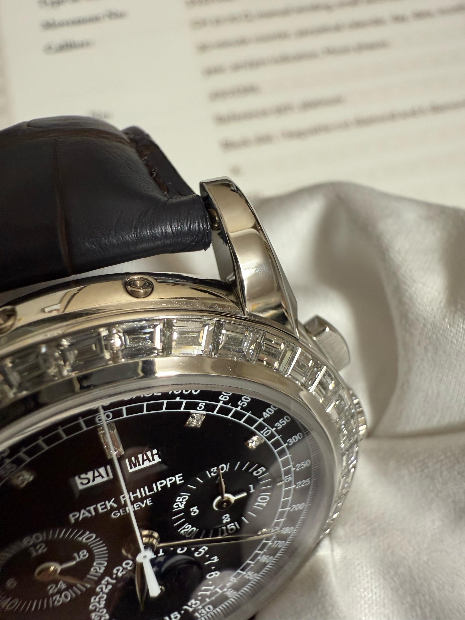 Patek Philippe Ref. 5971 Platinum, perpetual calendar chronograph with baguette diamond bezel. 2010 example with Letter of Archives & extra platinum caseback.