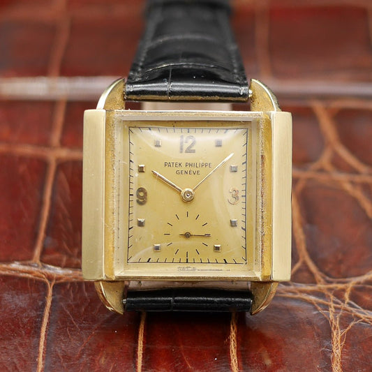 Patek Philippe Ref. 2425 in yellow gold, circa 1947, 32x26mm, featuring a pink gold dial, applied numerals, and teardrop lugs.