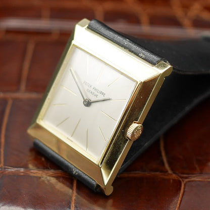 Patek Philippe square watch in yellow gold, circa 1960, featuring a timeless design and manual-winding movement.