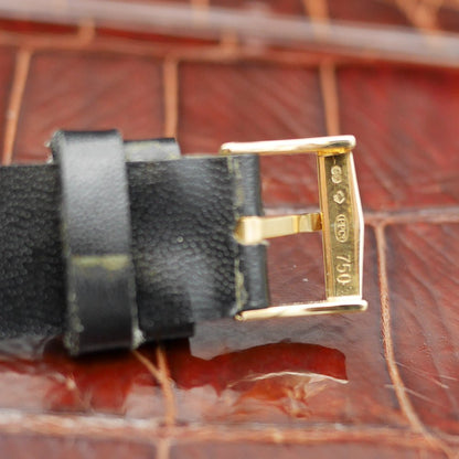 Patek Philippe square watch in yellow gold, circa 1960, featuring a timeless design and manual-winding movement.
