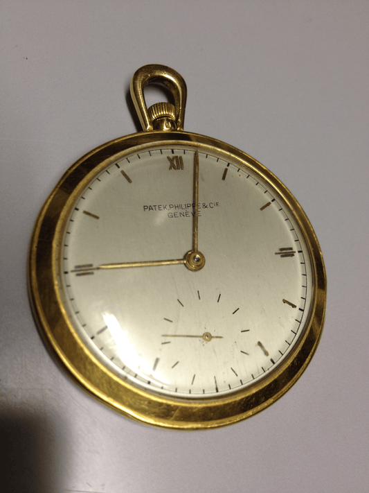 Vintage Patek Philippe pocket watch in yellow gold, circa 1940, featuring a small seconds subdial at 6 o’clock.