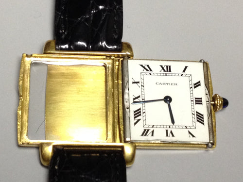 Cartier Tank with fold over case in Yellow gold. Circa: 1960.