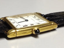 Load image into Gallery viewer, Cartier Tank with fold over case in Yellow gold. Circa: 1960.
