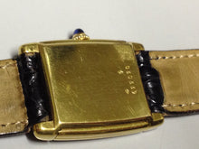 Load image into Gallery viewer, Cartier Tank with fold over case in Yellow gold. Circa: 1960.
