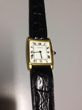 Load image into Gallery viewer, Cartier Tank with fold over case in Yellow gold. Circa: 1960.
